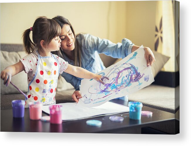 Bulgaria Acrylic Print featuring the photograph Cute Little Girl Painting With Mommy Together At Home, Portrait Of Mother And Daughter Painting At Home by ArtistGNDphotography