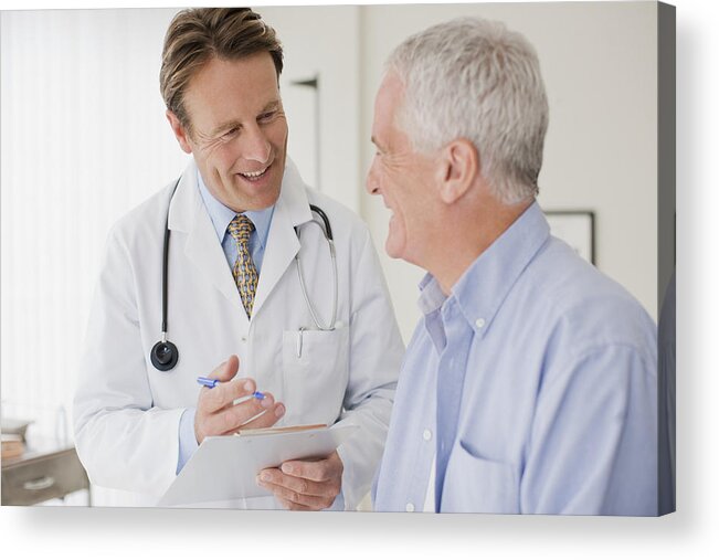 Expertise Acrylic Print featuring the photograph Doctor talking with patient in doctors office by Martin Barraud