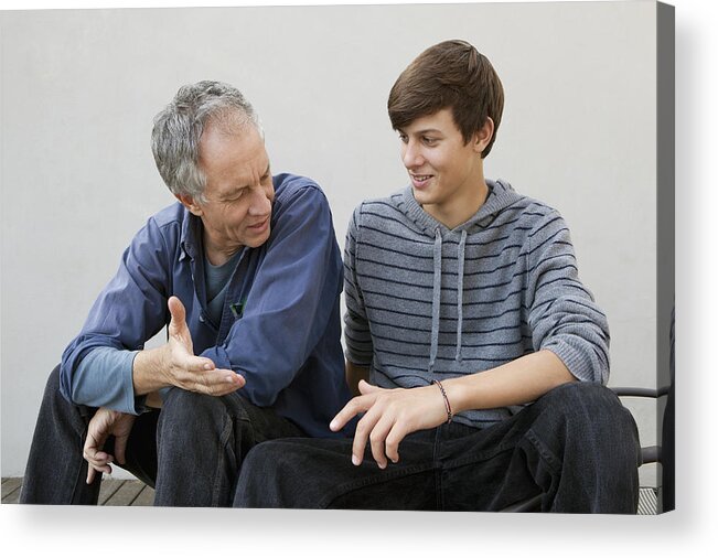 Three Quarter Length Acrylic Print featuring the photograph Father and son sitting together by Clarissa Leahy