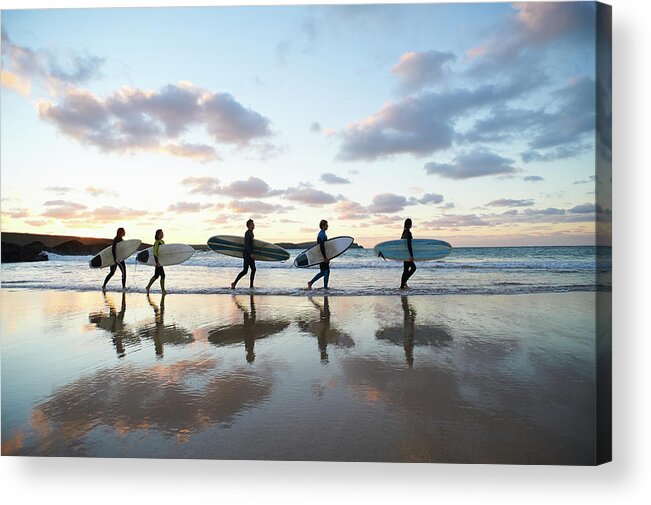 Summer Acrylic Print featuring the photograph Five Surfers Walk Along Beach With Surf by Dougal Waters