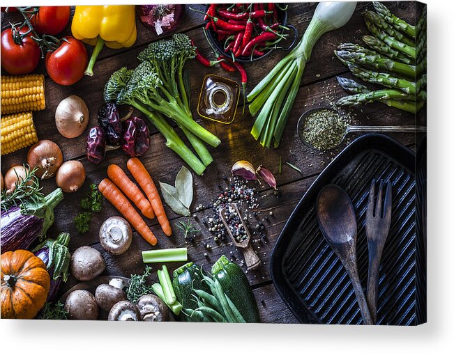 Cutting Board Acrylic Print featuring the photograph Fresh vegetables ready for cooking shot on rustic wooden table by Fcafotodigital