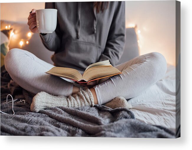 Internet Acrylic Print featuring the photograph Girl drinking hot tea and reading book in bed by Petrunjela