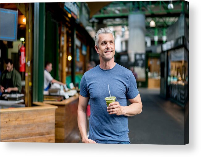 Protein Drink Acrylic Print featuring the photograph Healthy man having a smoothie by Andresr