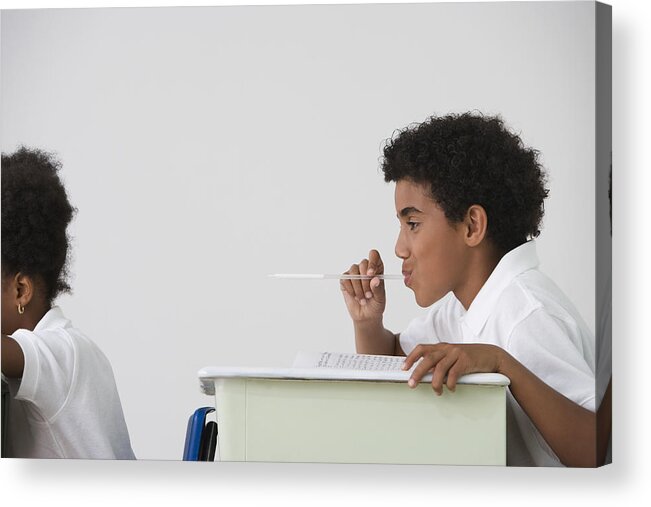 Problems Acrylic Print featuring the photograph Hispanic boy blowing spitball on girl in class by Jose Luis Pelaez Inc