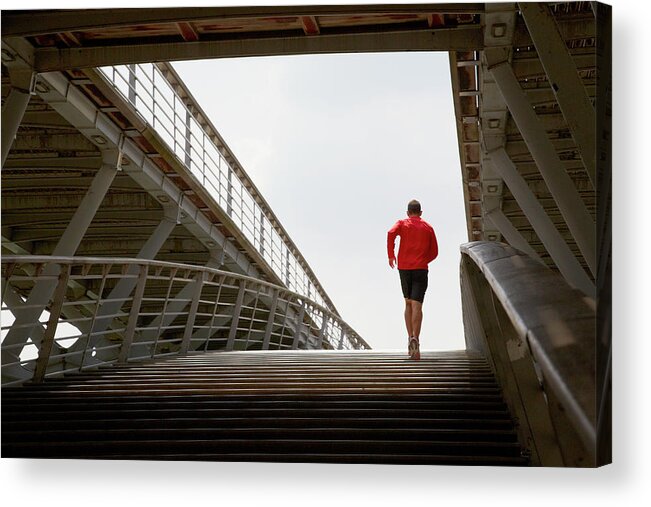 Steps Acrylic Print featuring the photograph Man Running Up A Bridge by Chris Tobin