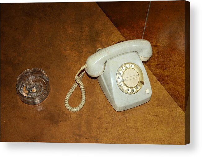 Phone Acrylic Print featuring the photograph Old telephone and ashtray on brown table by Matthias Hauser
