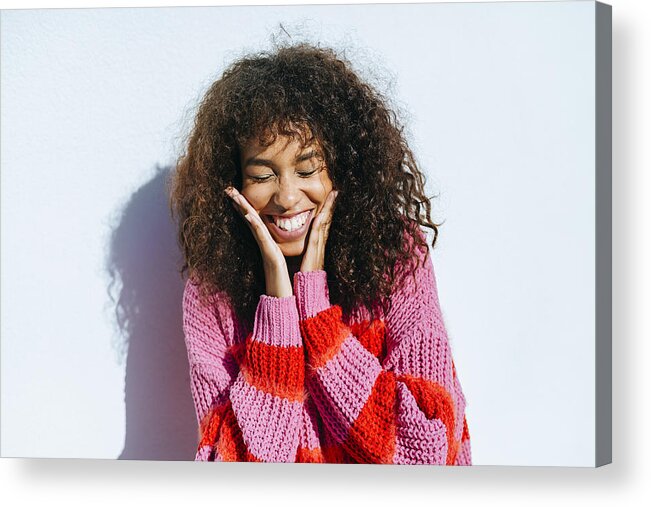 Shadow Acrylic Print featuring the photograph Portrait of laughing young woman with curly hair against white wall by Westend61