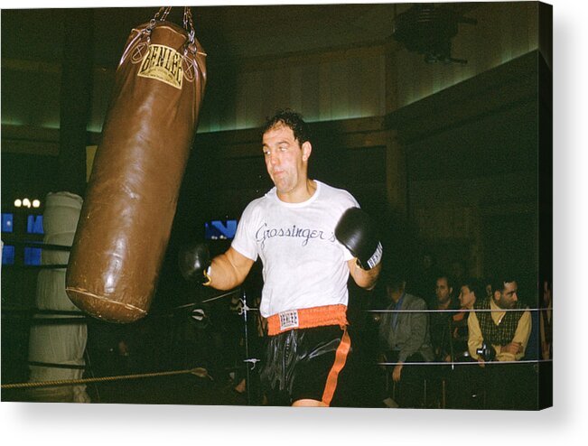 Marvin Newman Acrylic Print featuring the photograph Rocky Marciano Working Heavy Bag by Retro Images Archive