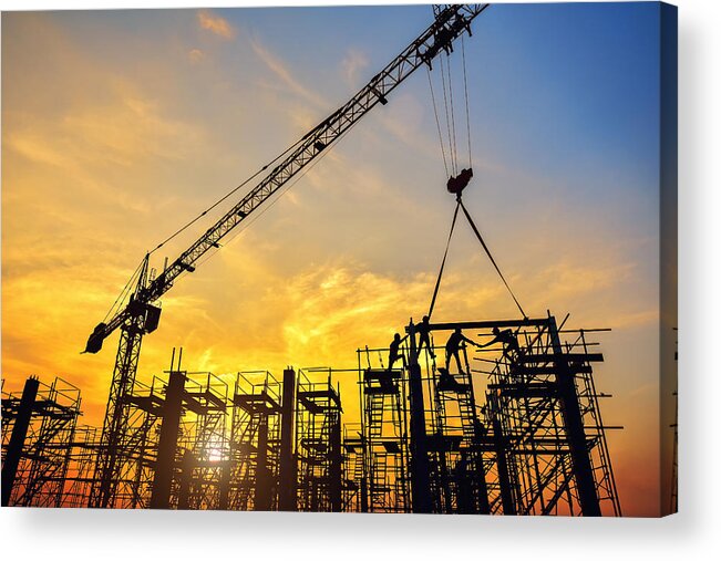 Working Acrylic Print featuring the photograph Silhouette of engineer and safety officer looking construction worker pouring a concrete column on scaffolding in construction site by Jung Getty