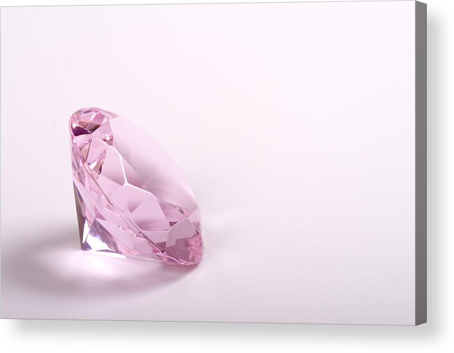 White Background Acrylic Print featuring the photograph Single pink diamond on white background copyspace right by Ebrink