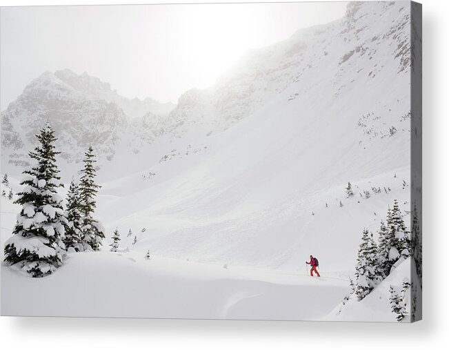 Skiing Acrylic Print featuring the photograph Skier Climbs Snowy Ridge Below Misty by Ascent Xmedia