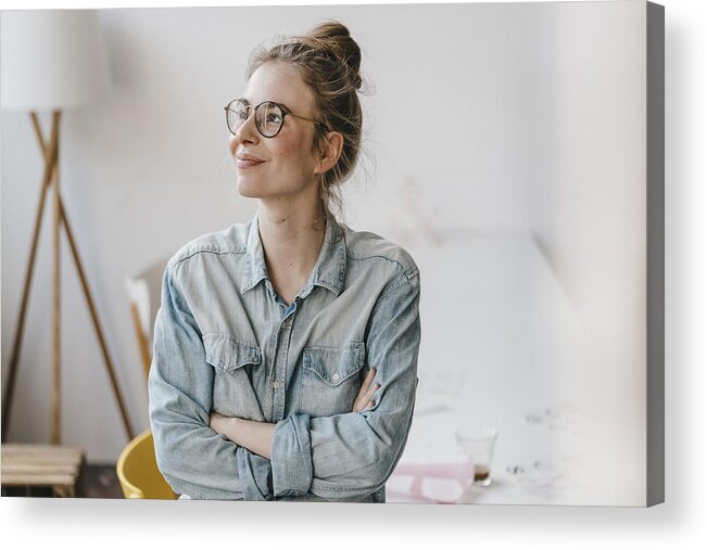 Freelance Work Acrylic Print featuring the photograph Smiling young woman in office looking sideways by Westend61