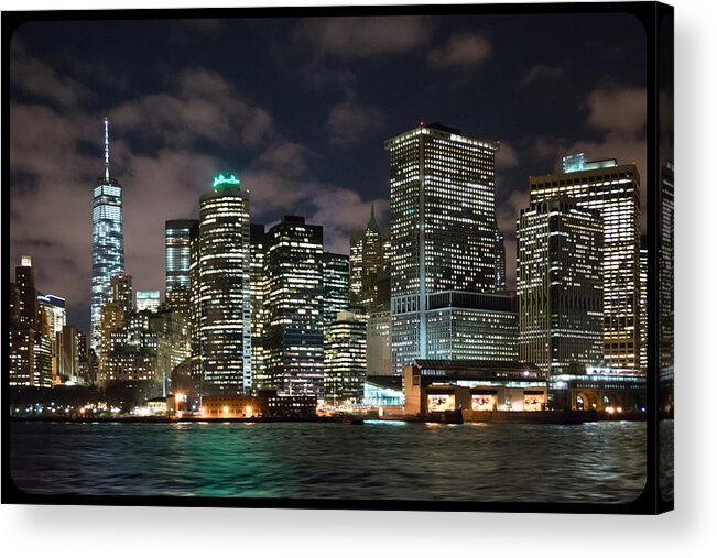 View Of South Ferry Manhattan New York City At Night From The Water Acrylic Print featuring the photograph South Ferry Manhattan at Night by Kenneth Cole