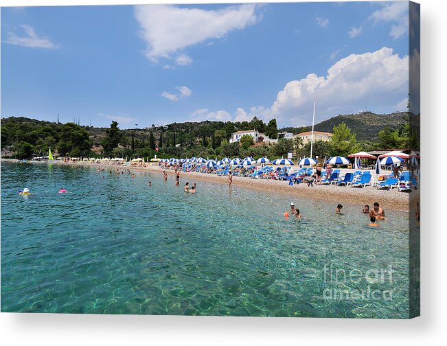 Spetses; Agii Anargiri; Saint Anargiri; Beach; Greece; Greek; Hellas; Greek; Hellenic; Argosaronic; Saronic; Gulf; People; Tourists; Island; Swim; Swimming; Sunbathing; Suntanning; Suntan; Tanning; Relaxing; Relaxation; Sea; Islands; Holidays; Vacation; Travel; Trip; Voyage; Journey; Tourism; Touristic; Summer; Trees; Umbrellas; Parasols; Sunshades; Sun Beds; Sea Beds; Clear Water; Transparent Water Acrylic Print featuring the photograph Agii Anargiri beach in Spetses island by George Atsametakis