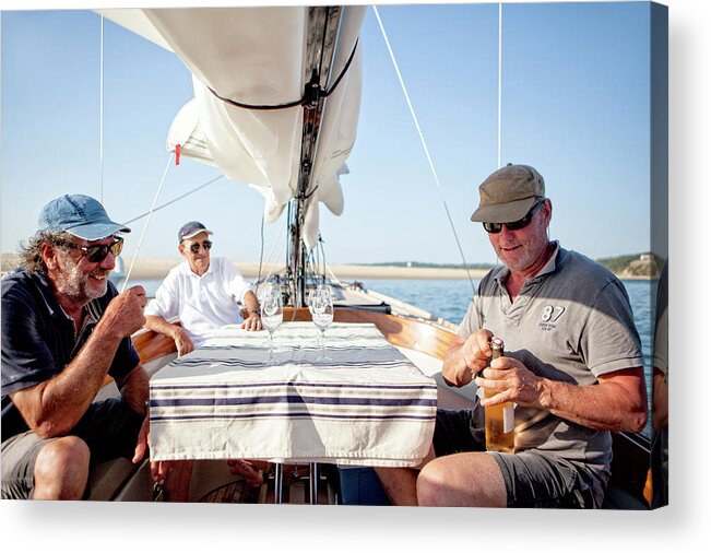 Wine Glass Acrylic Print featuring the photograph Three Men With Wine Onboard Sailboat by Christophe Launay