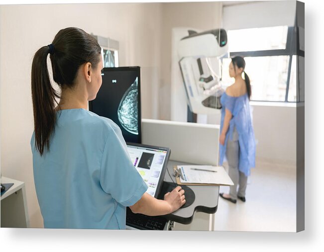 People Acrylic Print featuring the photograph Unrecognizable nurse taking a mammogram exam to an adult patient by Andresr