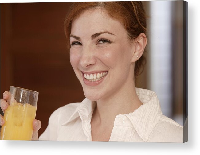 Mid Adult Women Acrylic Print featuring the photograph Woman drinking juice by Comstock Images