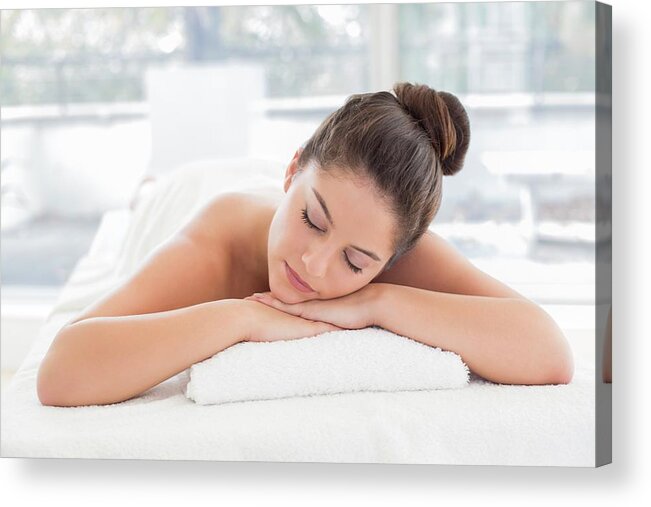 One Person Acrylic Print featuring the photograph Woman Lying On Towel In Spa by Ian Hooton/science Photo Library