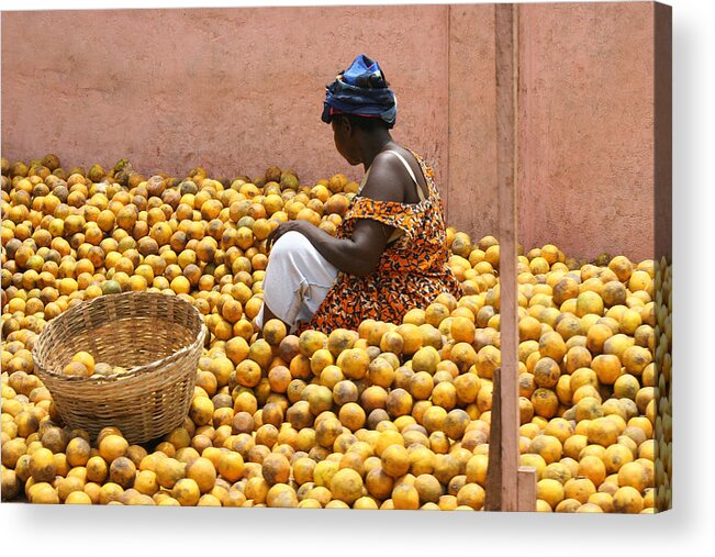 Three Quarter Length Acrylic Print featuring the photograph Woman selling oranges at market in Ghana by Nisa and Ulli Maier Photography