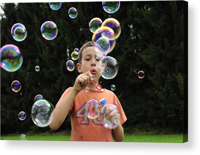 Bubbles Acrylic Print featuring the photograph Boy with colorful bubbles by Matthias Hauser