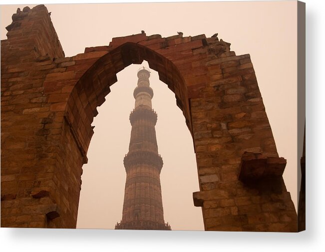 Muslim Acrylic Print featuring the photograph Cross section of the Qutub Minar framed within an archway in foggy weather by Ashish Agarwal