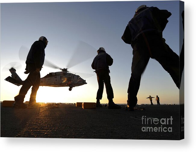 Military Acrylic Print featuring the photograph Sailors Watch A Helicopter Lift by Stocktrek Images