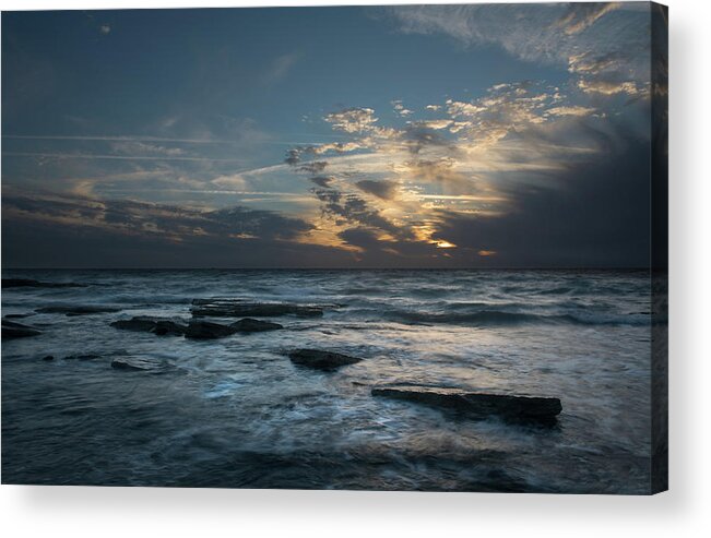 Sunset Over Sea Acrylic Print featuring the photograph Sunset on a rocky beach by Michalakis Ppalis