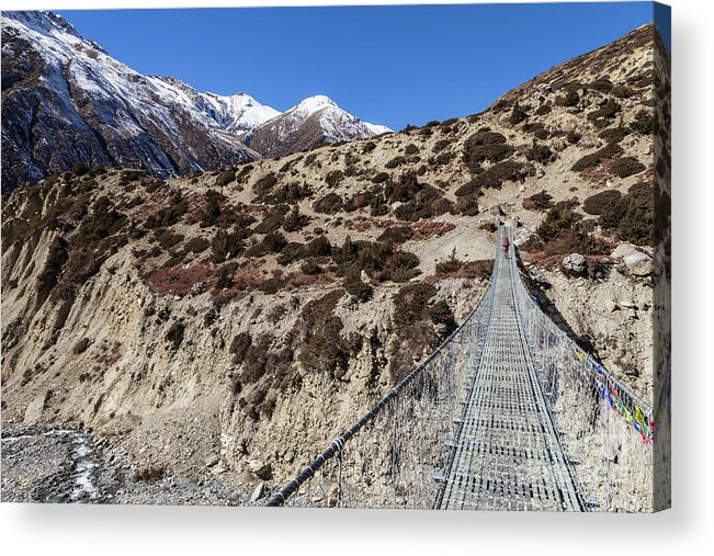Annapurna Circuit Acrylic Print featuring the photograph Suspension bridge along the Annapurna circuit trek #1 by Didier Marti