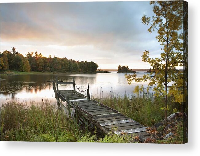 Sunrise Acrylic Print featuring the photograph A Dock On A Lake At Sunrise Near Wawa by Susan Dykstra