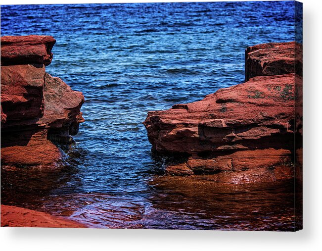 Bluffs By The Ocean Acrylic Print featuring the photograph Blue Water Between Red Stone by Chris Bordeleau