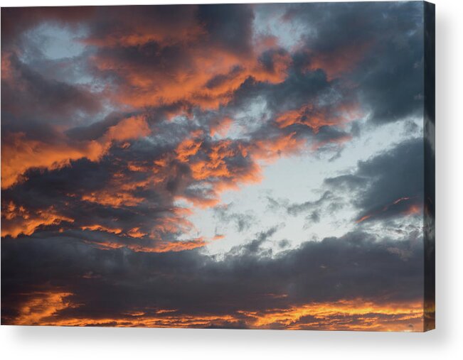 Stormy Clouds Acrylic Print featuring the photograph Dramatic sunset sky with orange cloud colors by Michalakis Ppalis