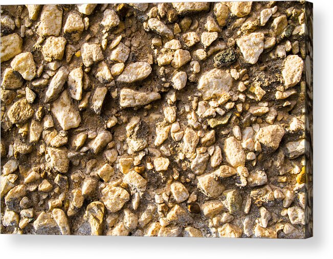 Stone Gravel Acrylic Print featuring the photograph Gravel stones on a wall by John Williams