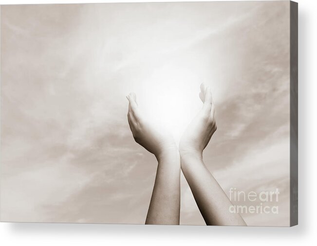 Hands Acrylic Print featuring the photograph Raised hands catching sun on cloudy sky. Concept of spirituality, wellbeing, positive energy by Michal Bednarek