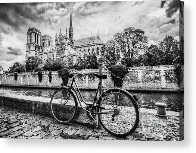 Paris Acrylic Print featuring the photograph Retro bike next to Notre Dame Cathedral in Paris, France. Black and white by Michal Bednarek