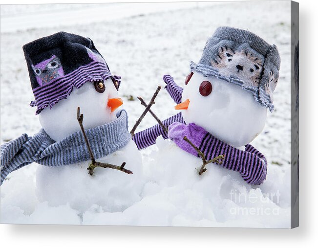 Snowmen Acrylic Print featuring the photograph Two cute snowmen friends embracing by Simon Bratt