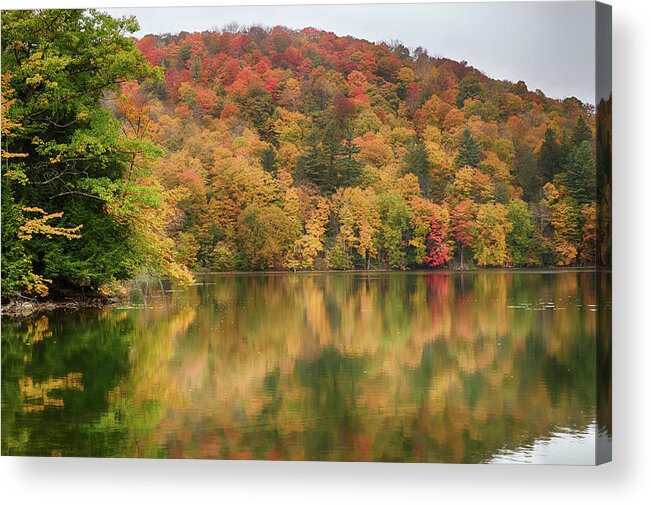 Abenaki Acrylic Print featuring the photograph Vermont fall foliage reflected on Pogue Pond by Jeff Folger