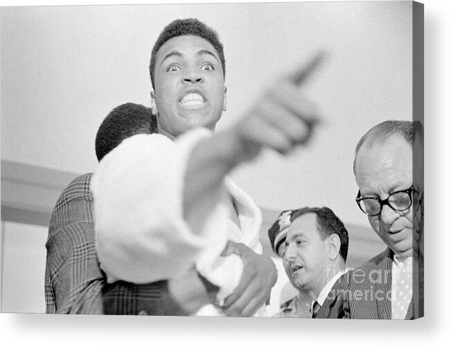 Fighting Acrylic Print featuring the photograph Cassius Clay Vs Sonny Liston #1 by The Stanley Weston Archive