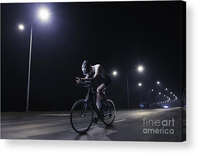 Headwear Acrylic Print featuring the photograph Cyclist Riding At Night In The City #2 by Stanislaw Pytel