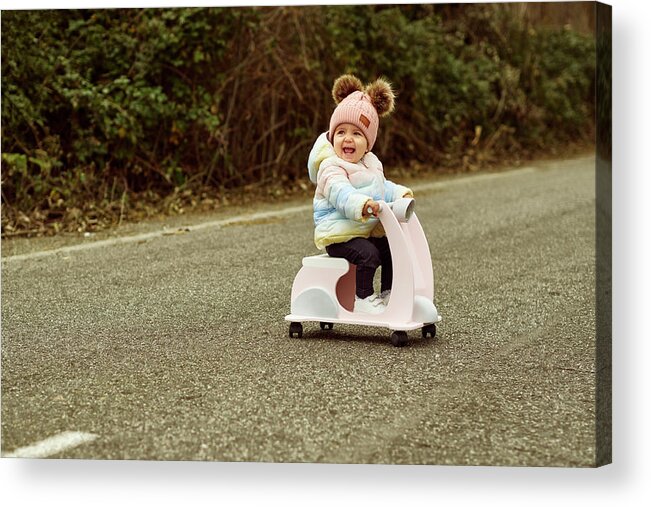 Baby Acrylic Print featuring the photograph A 1 Year Old Baby Girl Is With A Pink Motorcycle Outside #4 by Cavan Images