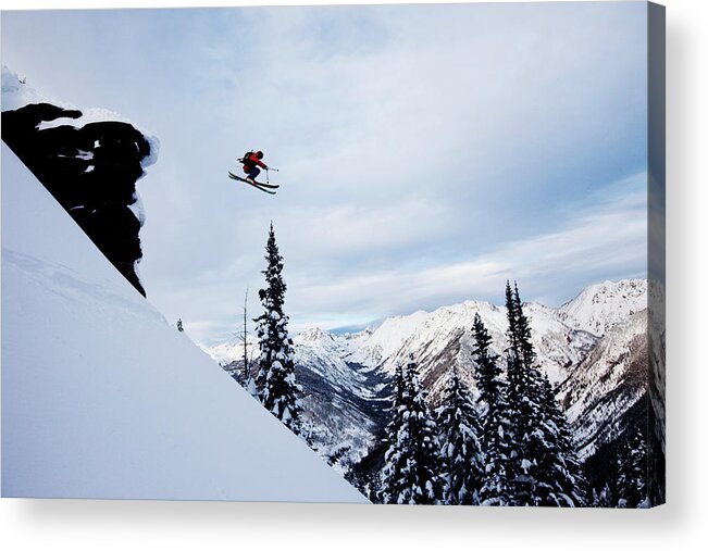 Skiing Acrylic Print featuring the photograph A Athletic Skier Jumping Off A Cliff In by Patrick Orton