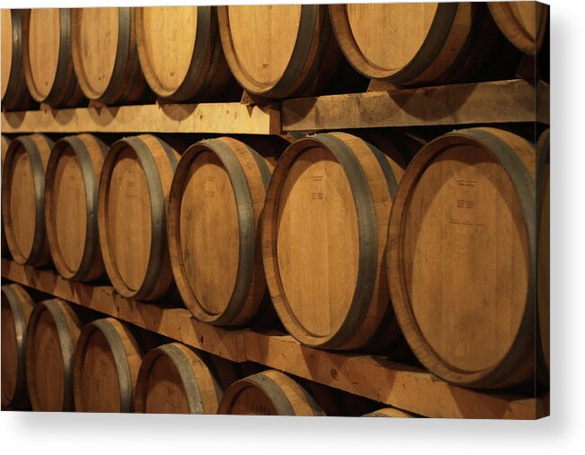 Aging Process Acrylic Print featuring the photograph Barrels Of Wine In Cellar by Tom And Steve