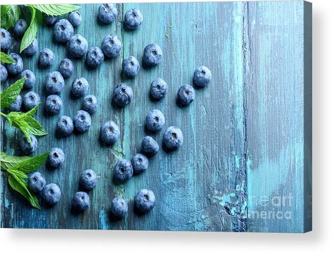 Blueberries Acrylic Print featuring the photograph Blueberries ion blue wooden table by Jelena Jovanovic