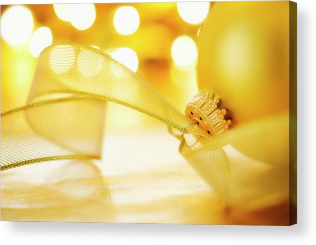 Christmas Ornament Acrylic Print featuring the photograph Close-up Of Christmas Ball With Ribbon by Tetra Images