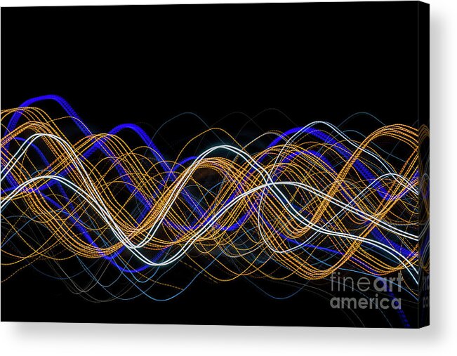 Abstract Acrylic Print featuring the photograph Colorful light painting with circular shapes and abstract black background. by Joaquin Corbalan