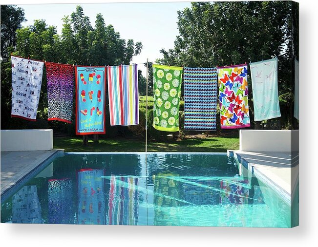 Ip_11244046 Acrylic Print featuring the photograph Colourful Patterned Towels On Washing Line On Edge Of Pool In Garden by Winfried Heinze