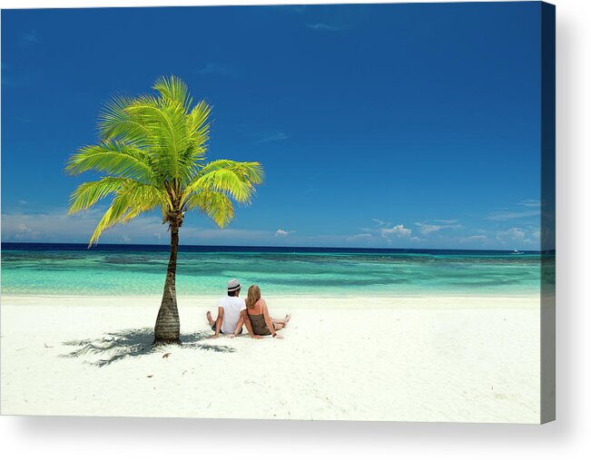 Young Men Acrylic Print featuring the photograph Couple Sitting On Tropical Beach by Dstephens