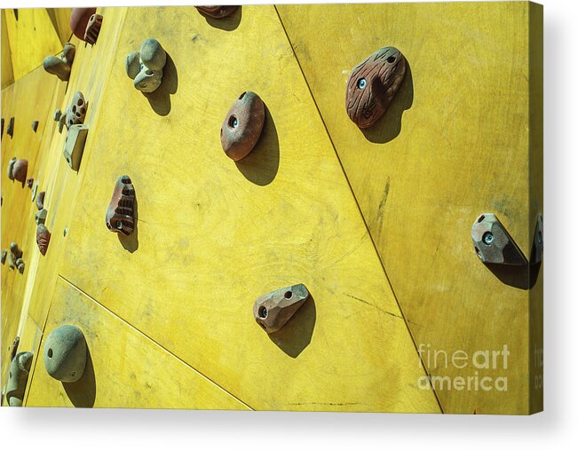 Architecture Acrylic Print featuring the photograph Detail of the wall of an outdoor climbing wall to practice climbing by Joaquin Corbalan
