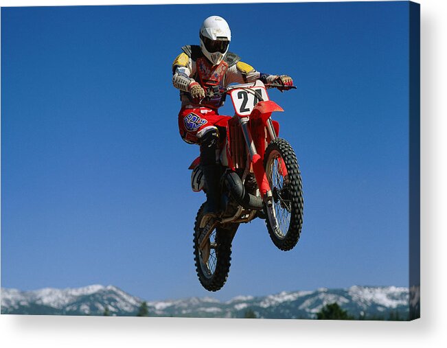 Crash Helmet Acrylic Print featuring the photograph Dirt Biker In Mid-air by Stockbyte