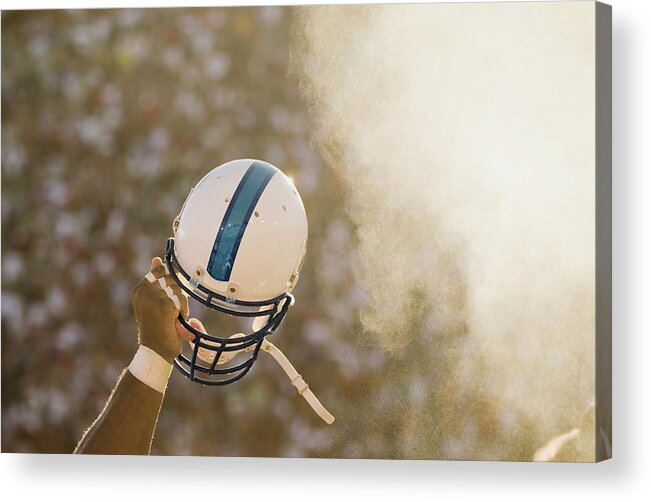 Celebration Acrylic Print featuring the photograph Football Player Waving Helmet In Air by David Madison