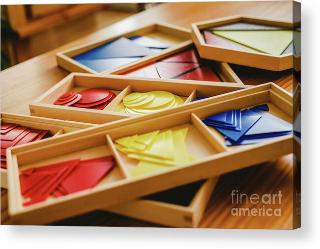Arithmetic Acrylic Print featuring the photograph Geometric material in Montessori classroom for the learning of children in mathematics area. by Joaquin Corbalan